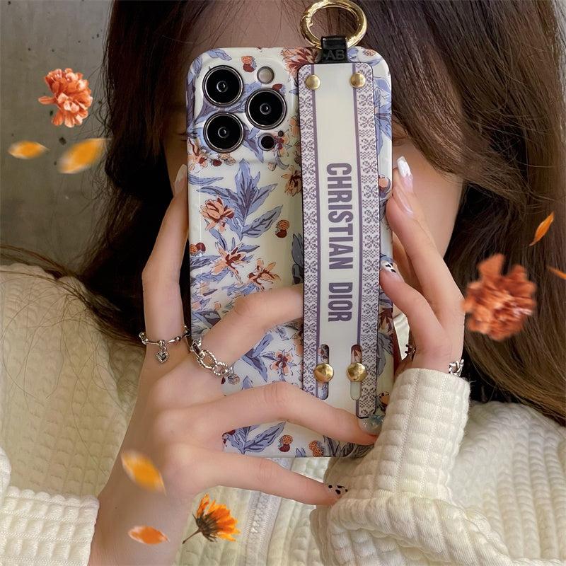 CD Floral Belt Case Cover for iPhone 15 Series | Premium Brand Edition | Hand Strap Designer Protection