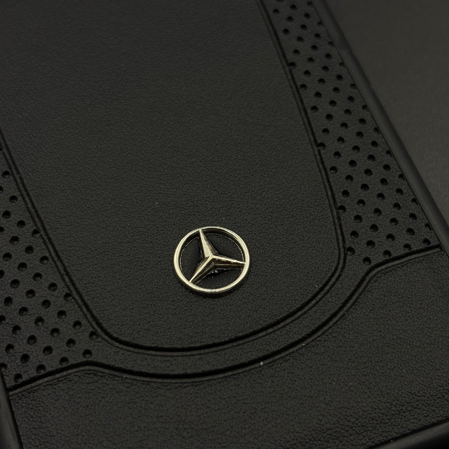 Black Perf Line Luxury Sports Car Merc Case for iPhone 17 with Perforated Detail